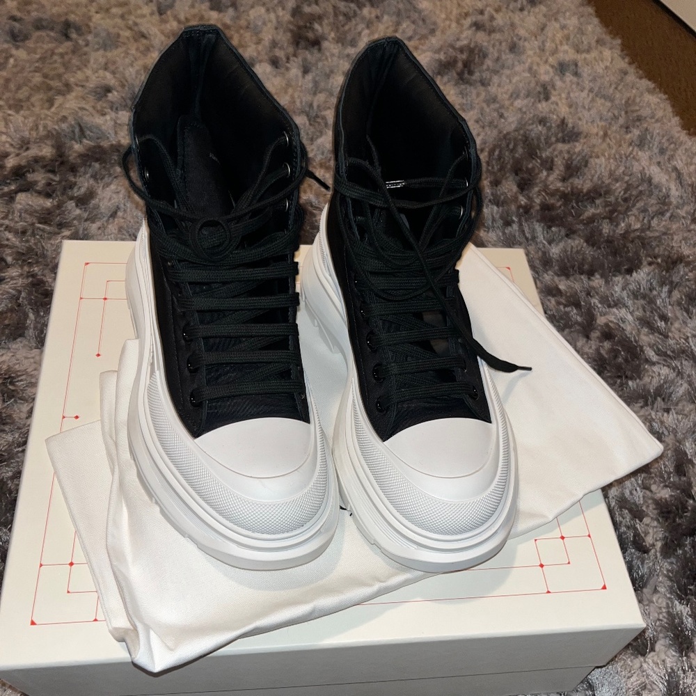 Alexander McQueen black and white slick boots.